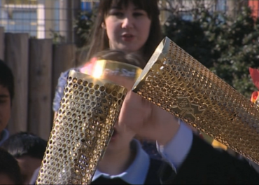 Torch Burns Gold for Olympics 2012 Olympics - meeting of flames