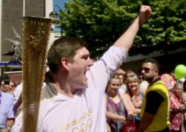 Flame Wows Torchbearers – heading for Olympic Park Flame carrier Jack Taylor