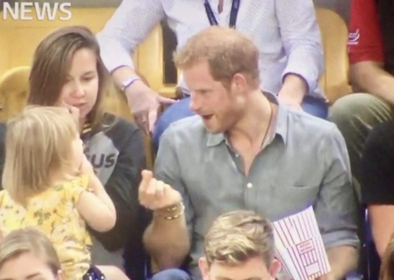 Prince Harry Has Fun With Toddler Who Takes His Popcorn – at Invictus Games Prince Harry Has Fun With Toddler Who Takes His Popcorn At Invictus Games