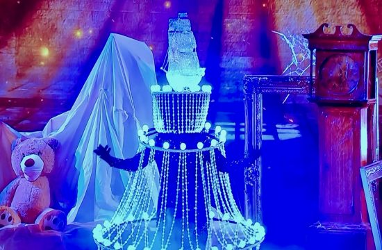 Heather unveiled as Chandelier in Masked Singer
