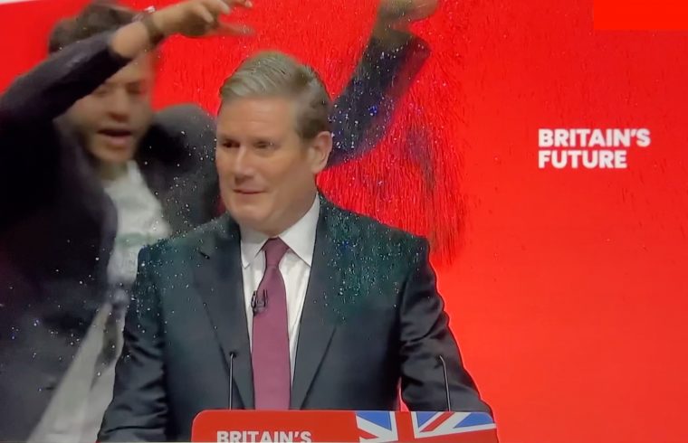 Protester showers Starmer with glitter
