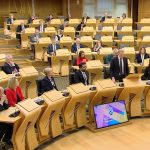 delivering statement to Scottish parliament
