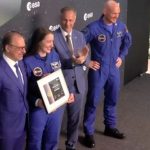 the astronaut certificate in hand