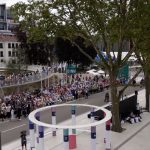 athletes gather on river seine