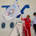 Los Angeles Mayor returns to LA with Olympic Flag