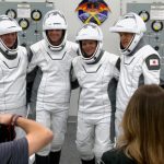 astronauts dressed and ready to go