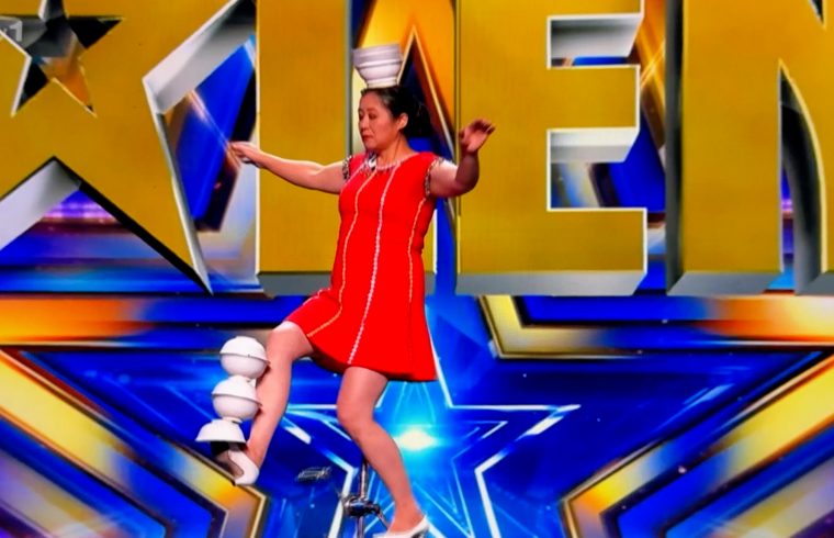 BGT: Unicyclist tosses plates on to her head