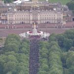 large crowd surrounded Buckingham Palace
