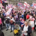 many carrying flags
