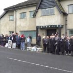 dedicated fans line the street for the funeral