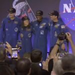 astronauts back and together