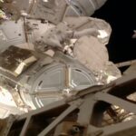 Sophie Adenot -placing antenna in place